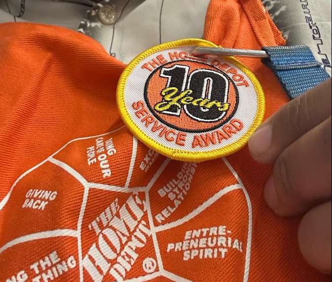 A Home Depo Employee shows their badge of "10 Years of Service!" What would the "Kingdom of God" Badge Say on our hearts - would it say "years of service?"